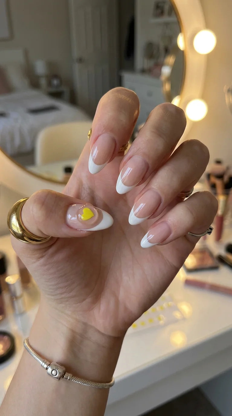 French manicure with a yellow heart drink test sticker